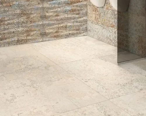 Closeup of beige tiling in a bathroom.