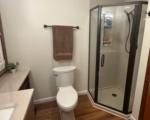 Bathroom remodel showing a new Onyx corner shower.